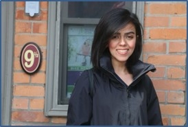 Dorsa Shahryari poses outside smiling, wearing a black jacket