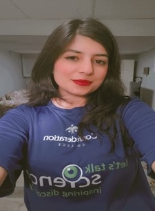 Kushagri Grover smiles in a selfie wearing her Let's Talk Science blue t-shirt