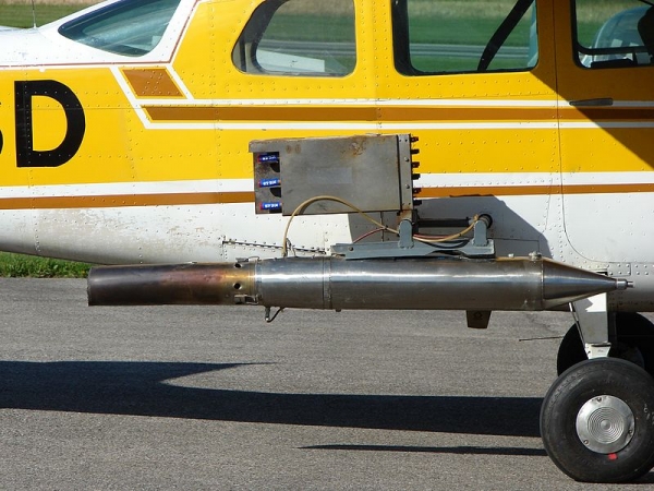 Cloud-seeding equipment attached to the side of a small aircraft