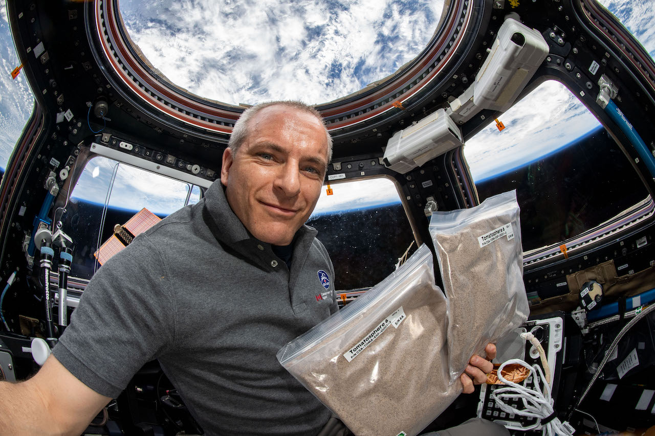 David Saint Jacques, ISS holding seeds space selfie