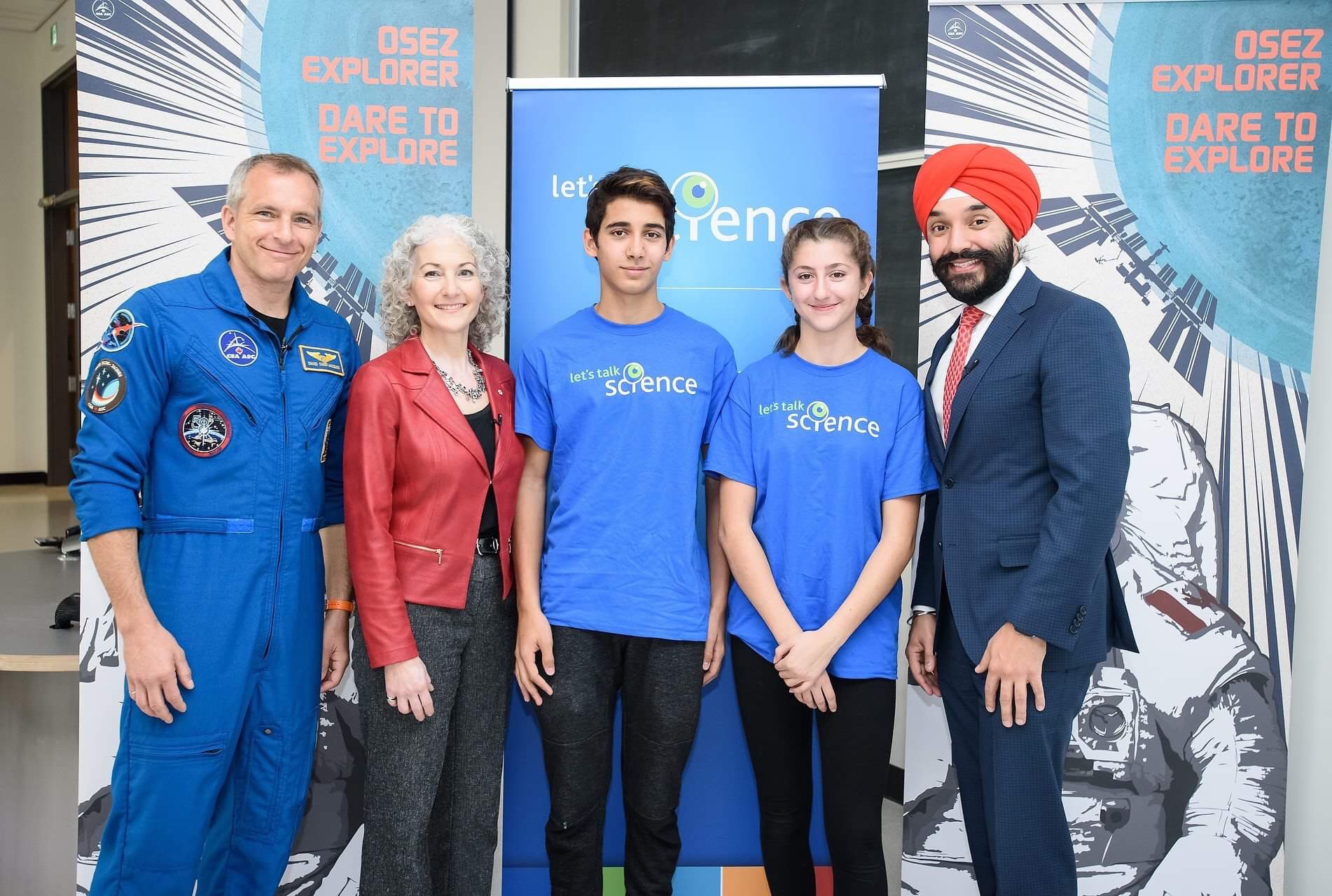 Canadian Space Agency Astronaut David Saint-Jacques, Let's Talk Science President Bonnie Schmidt, Outreach volunteers and the Honourable Navdeep Bains pose together at an event in Ottawa. 