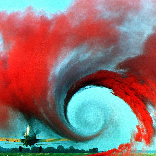 Smoke from a crop-duster shows wake turbulence