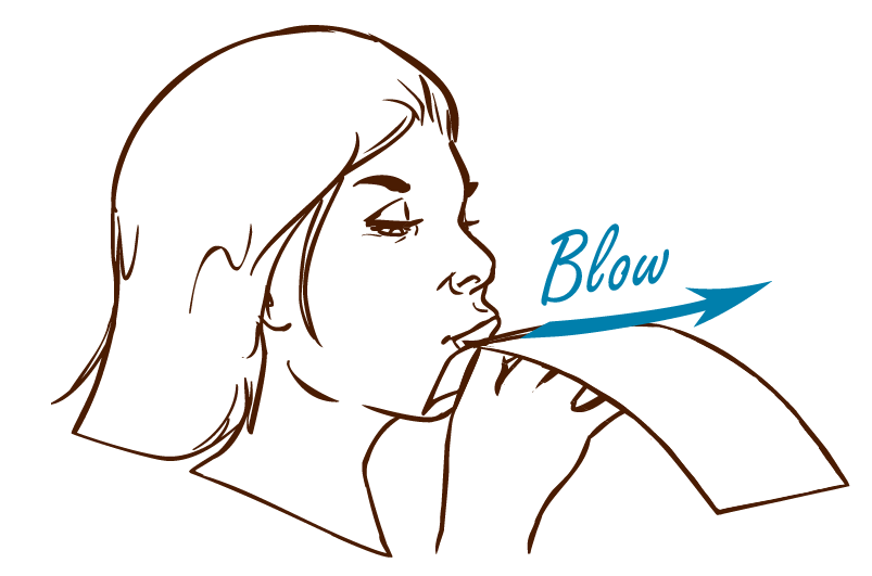 Person blowing on paper