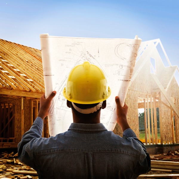 Construction worker with house plan 