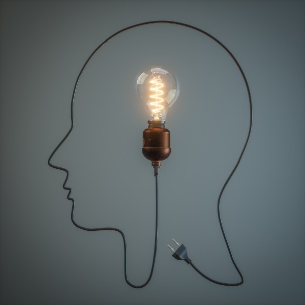 Light bulb and cord in shape of a head