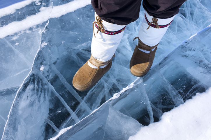Person with mukluks standing on ice