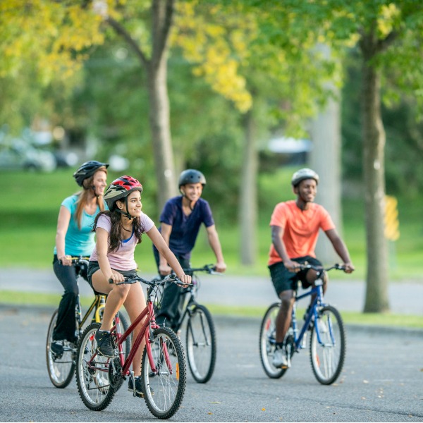 A group of teens riding bicycles
