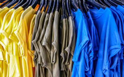 Shopping rack of t-shirts in three colours 