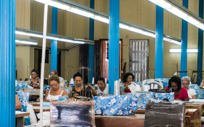 Garment workers stationed at sewing machines