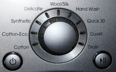 Cycle-setting dial on a washing machine.