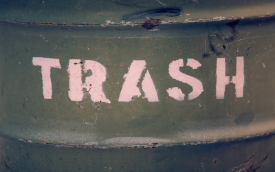 Barrel with the word "Trash" written on it.