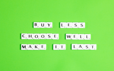 Scrabble tiles spelling out "Buy Less. Choose Well. Make It Last."