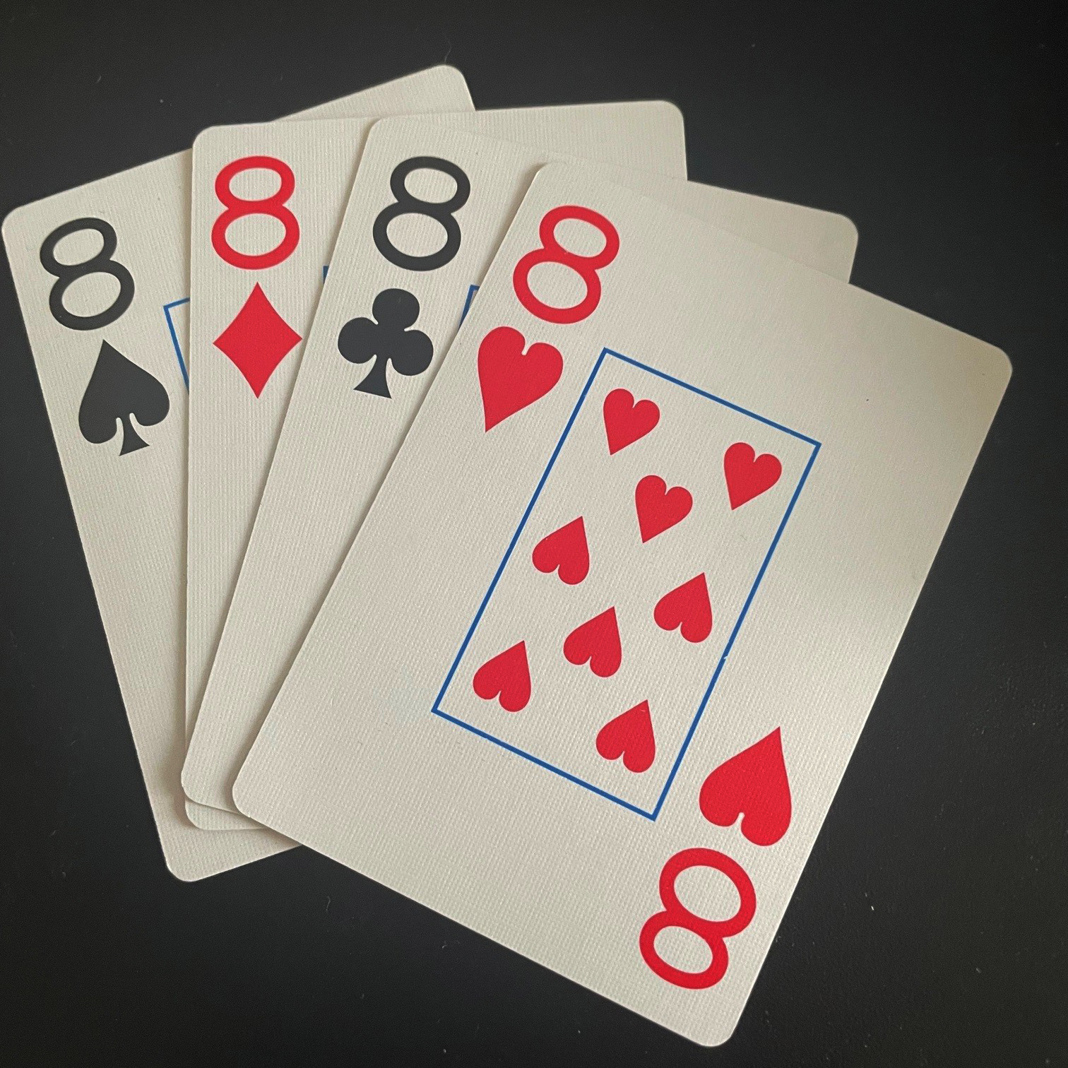 The four 8's in a standard deck of cards