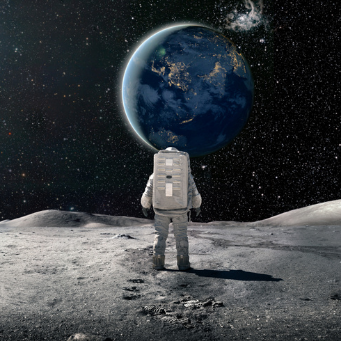 Astronaut on the moon gazing at the earth