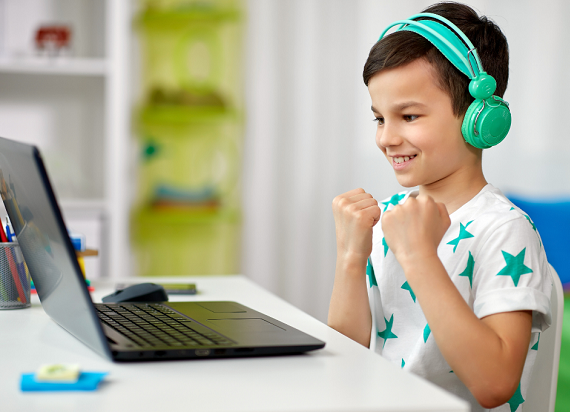 Child excited at laptop