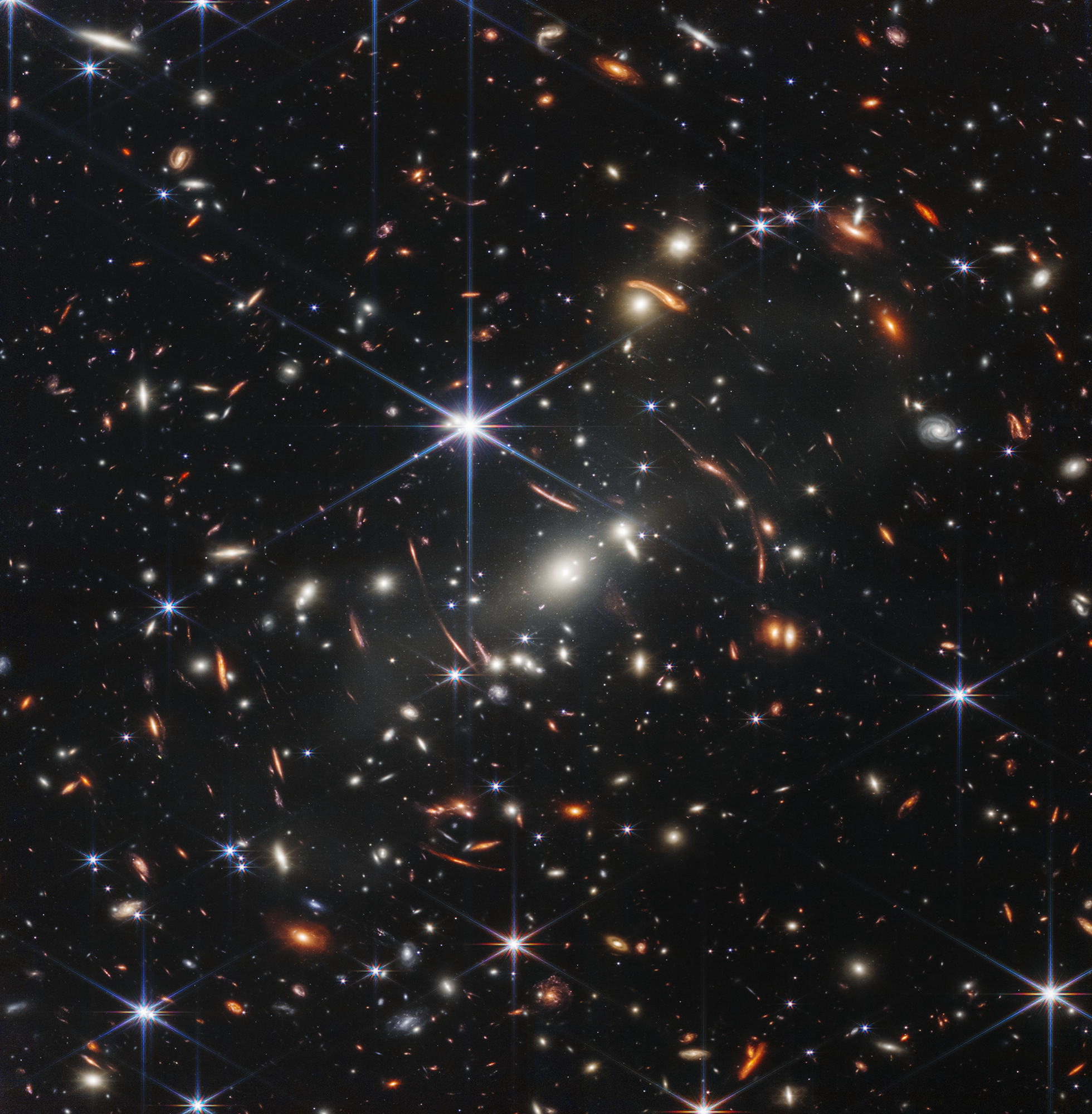 Shown is a colour photograph of black space sprinkled with bright, shining objects.