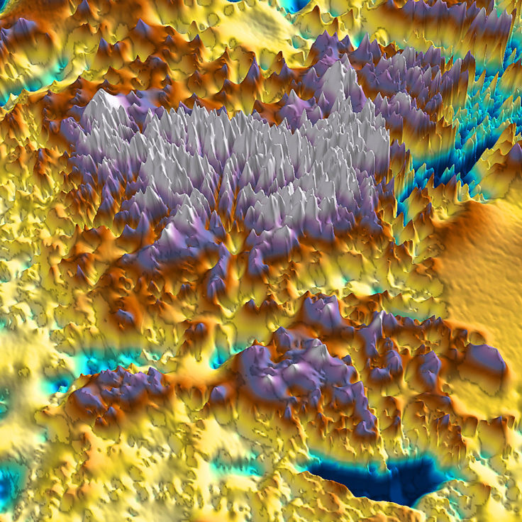 Shown is a relief map coloured brightly in blue, purple, yellow, red, and white.