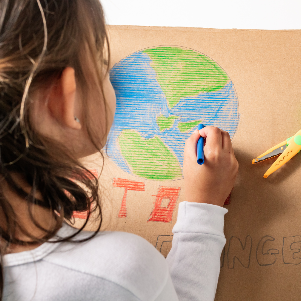  Child drawing the Earth with crayon