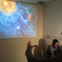 students reacting to an image projection