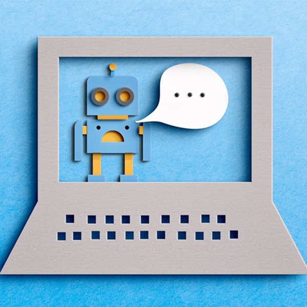 Paper cutout of chatbot on computer screen