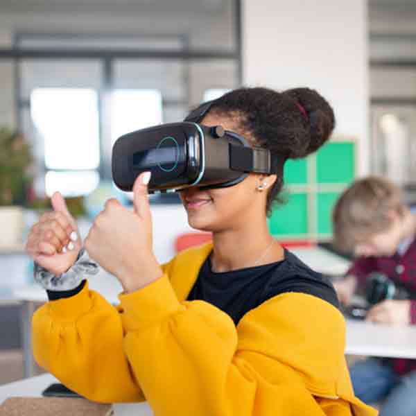 Student wearing a vr headset in a classroom