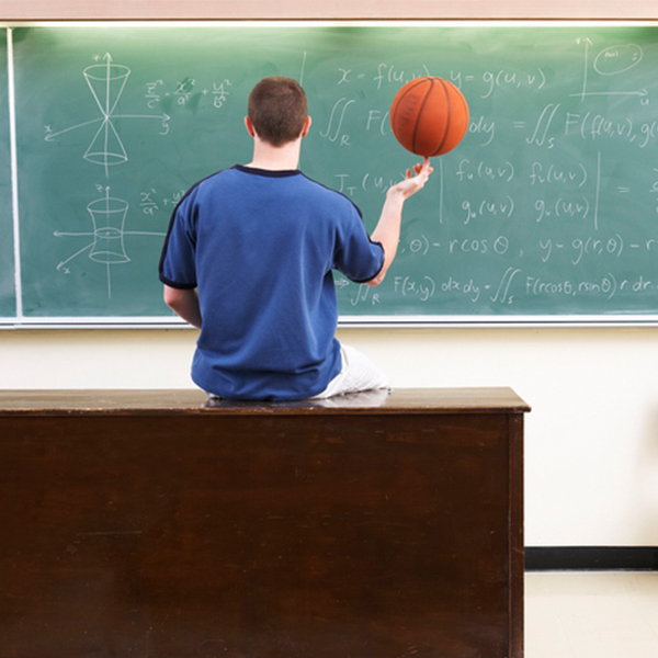 Basketball player in front of calculations on chalkboard