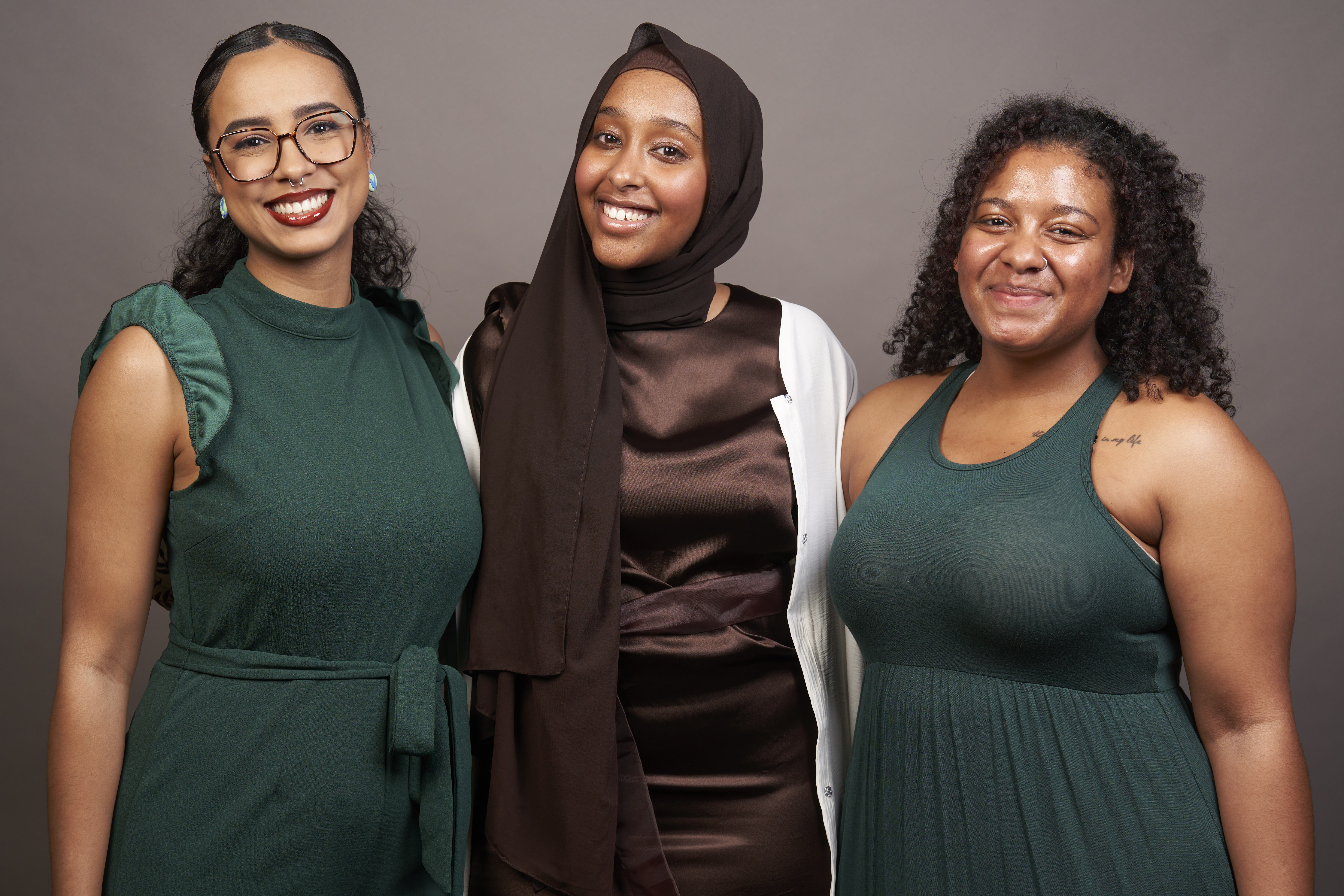 Amaal Abdi, Yasmine Elmi, and Destina Mattrasingh in formal wear