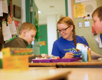 Let's Talk Science volunteer facilitating hands on activities with children