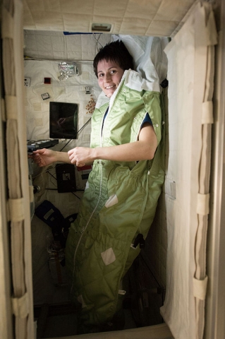 Astronaut Samantha Cristoforetti of the European Space Agency (ESA) is seen inside of a sleeping bag in her personal crew quarters on the International Space Station 