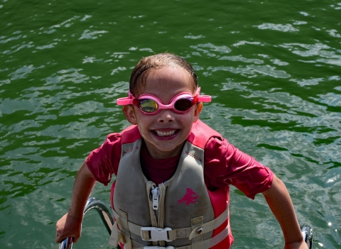 Child wearing a flotation vest 