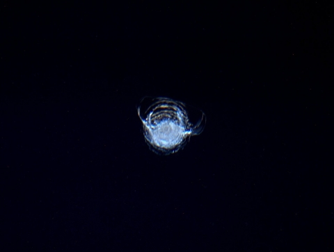 This photos shows a chip out of the International Space Station’s window. This chip was probably caused by a flying object a few thousandths of a millimetre  across - a hundredth the width of a human hair!