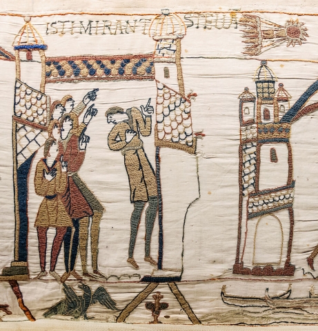 Men staring and pointing at Halley’s comet as portrayed in the Bayeux Tapestry from the 1070s