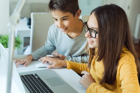 Children using laptop for online learning