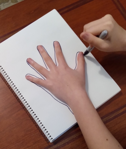 Tracing an outline of a hand