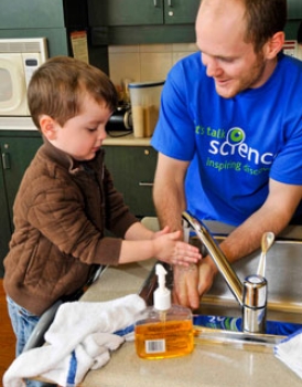 A Let’s Talk Science Outreach volunteer works with a student