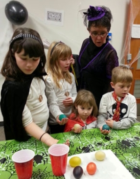 Kids participating in Halloween science activities