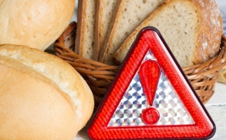 Bread and wheat with a warning sign