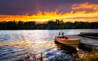 Boat on a lake at sunset