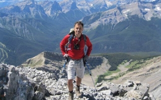 Alexander Sharif hiking in mountains.