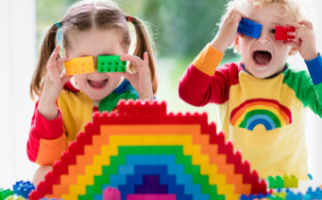 Kids make rainbow with building blocks