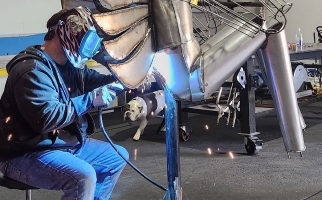 Kevin Stone working on a metal sculpture 