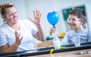 Boy doing science experiment with a balloon