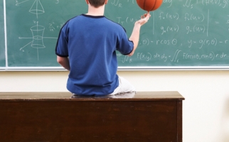 Basketball player in front of calculations on chalkboard