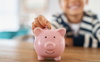 Child saving money in a piggybank