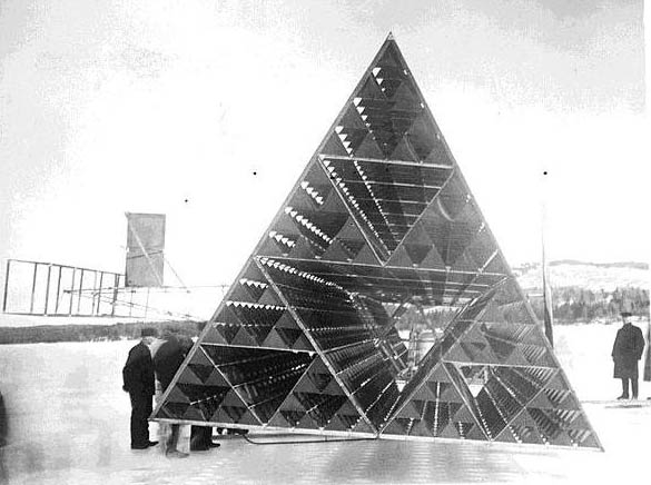 Alexander Graham Bell and his assistants with one of his large tetrahedral kites, 1909