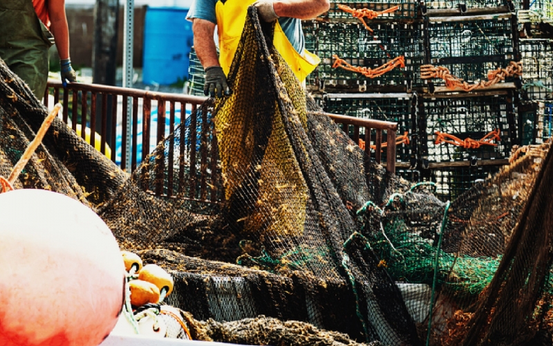 Fishing nets and fisherman on a trawler