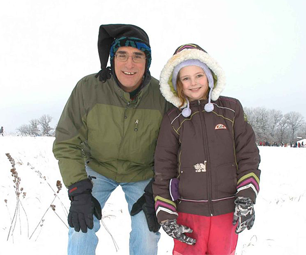 Father and daughter in winter clothing 