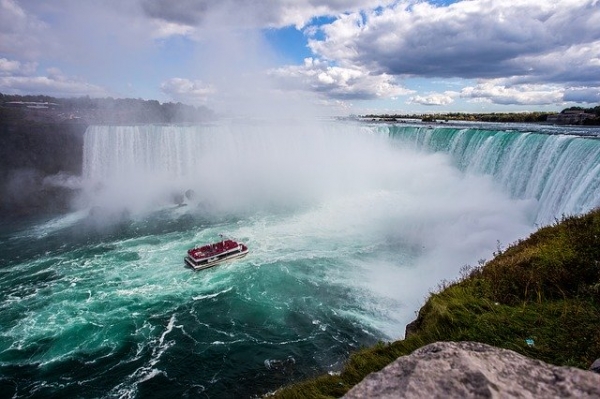A boat passes close to the bottom of Niagara Falls 