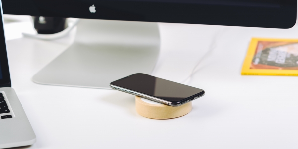 Smartphone sitting on a charging pad 