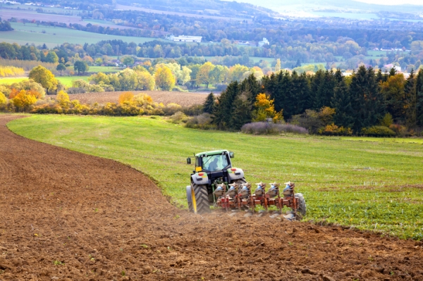 Tractor tilling soil